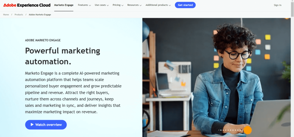 Marketo Engage webpage showing: a girl sitting with their laptop