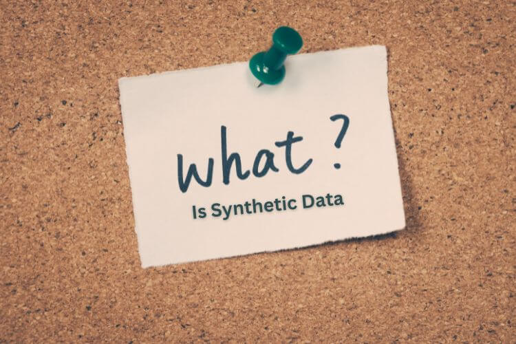 A note pinned to a corkboard with a green thumbtack reads, "What is Synthetic Data?"