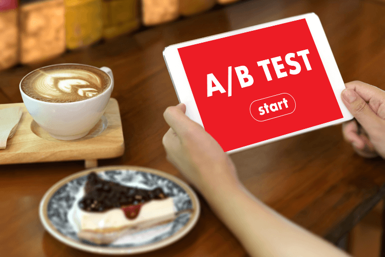 Tablet screen displaying 'A/B Test' with coffee and dessert, representing user retention experimentation