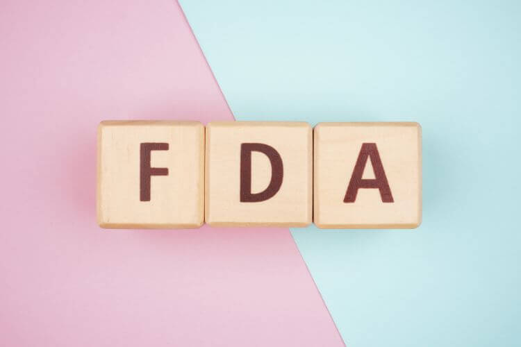 FDA abbreviation on wooden blocks highlighting the importance of clear, compliant health communication
