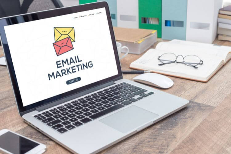 Laptop screen displaying email marketing dashboard for automation setup and campaign management