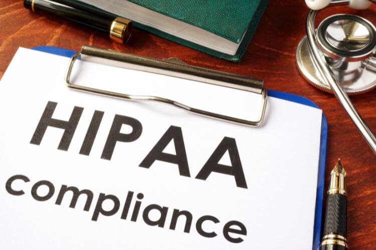 Clipboard with HIPAA compliance form representing secure and compliant healthcare marketing practices