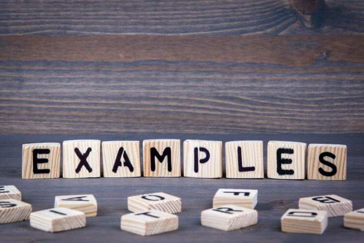 Scrabble-style wooden blocks spelling 'Examples' for showcasing referral program case studies
