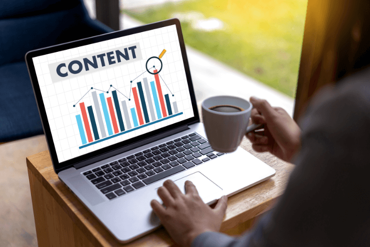 Laptop showing 'Content' analytics dashboard, highlighting dynamic blocks to boost engagement