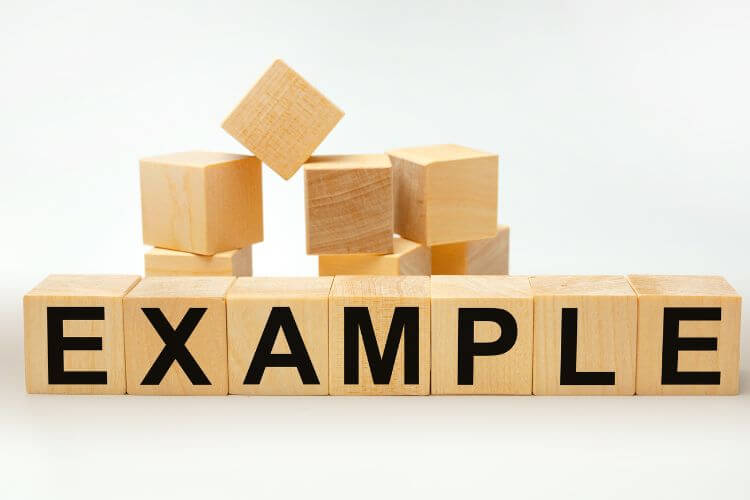 Wooden blocks spelling out “EXAMPLE” to illustrate sample marketing attribution strategies.