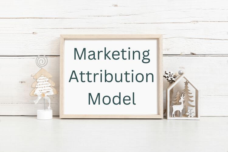 Framed sign reading “Marketing Attribution Model” in a minimalist setup for strategy concept.