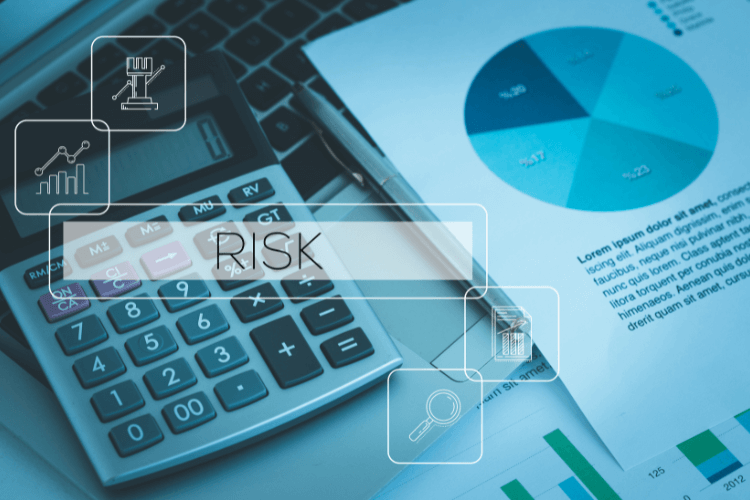 Calculator and financial documents highlighting cybersecurity risk analysis in vibe coding environments