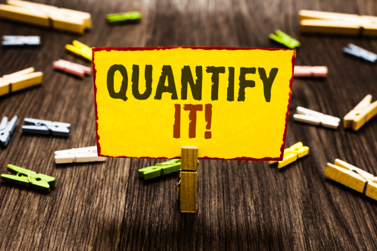 Yellow sign with bold text "QUANTIFY IT!" symbolizing data-driven decision-making and measurement.