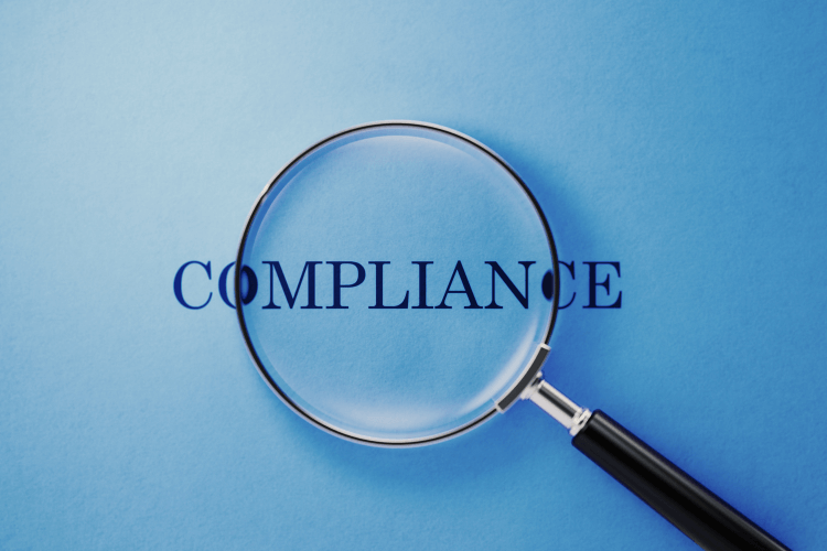 Magnifying glass highlighting compliance focus for risk management in context engineering.