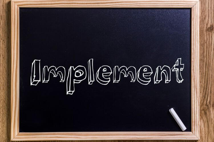 Implementing metrics concept on chalkboard for SaaS trial analysis