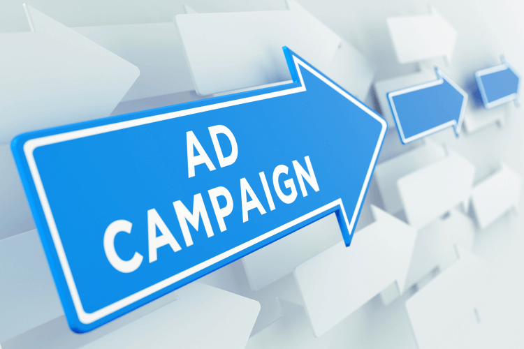 Blue arrow labeled ad campaign representing digital advertising direction