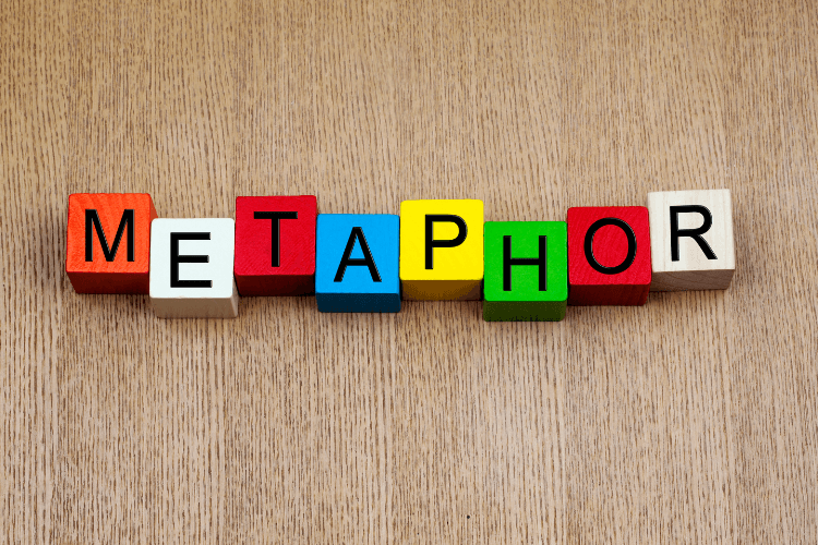 Colorful wooden blocks spelling metaphor, symbolizing AI metaphors for context and creativity limits.