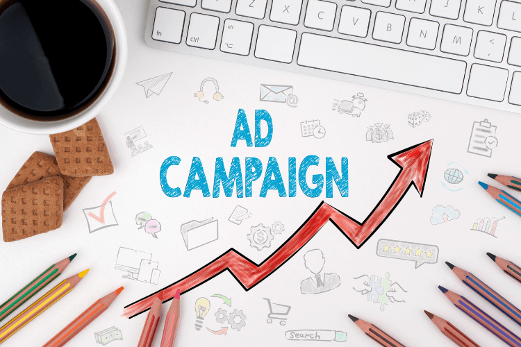 Ad campaign growth chart with pencils and coffee, symbolizing AI-driven ad targeting and testing.