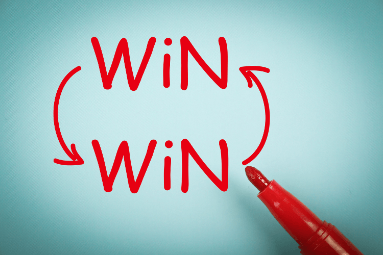 Win-Win written with red marker and circular arrows symbolizing mutual business success.