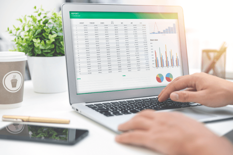 Person analyzing spreadsheet dashboard with charts and graphs on laptop for business reporting.