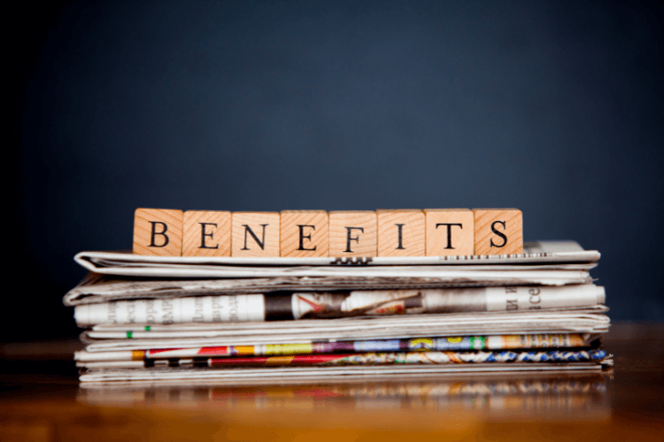 Benefits headline on stacked newspapers, illustrating hybrid search advantages for RAG stacks.